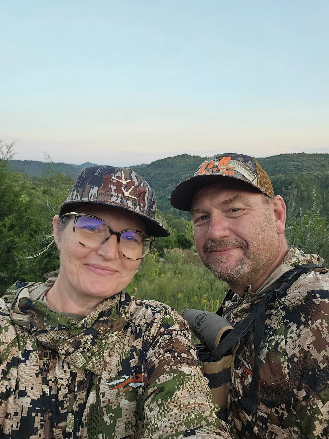 A family photo from Buck Creek, outdoors in camouflage